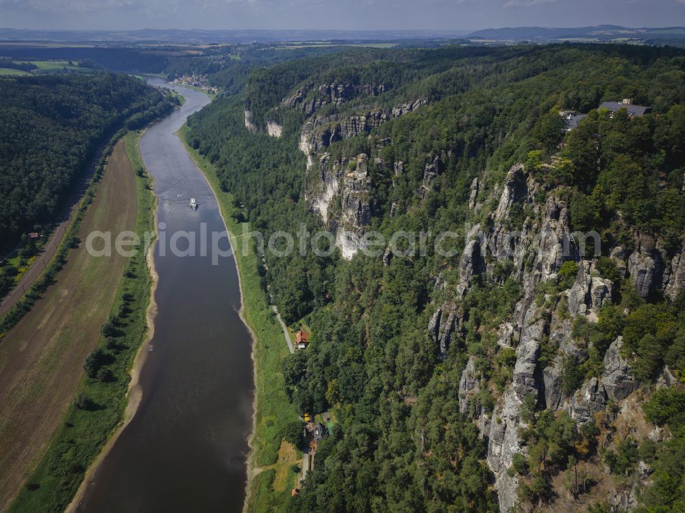 Rathen from the bird's eye view: Rock massif and rock formation and sandstone rocks in the Elbe Sand Mountains on the road Wehlener Weg in Rathen Bastei area in the federal state of Saxony, Germany