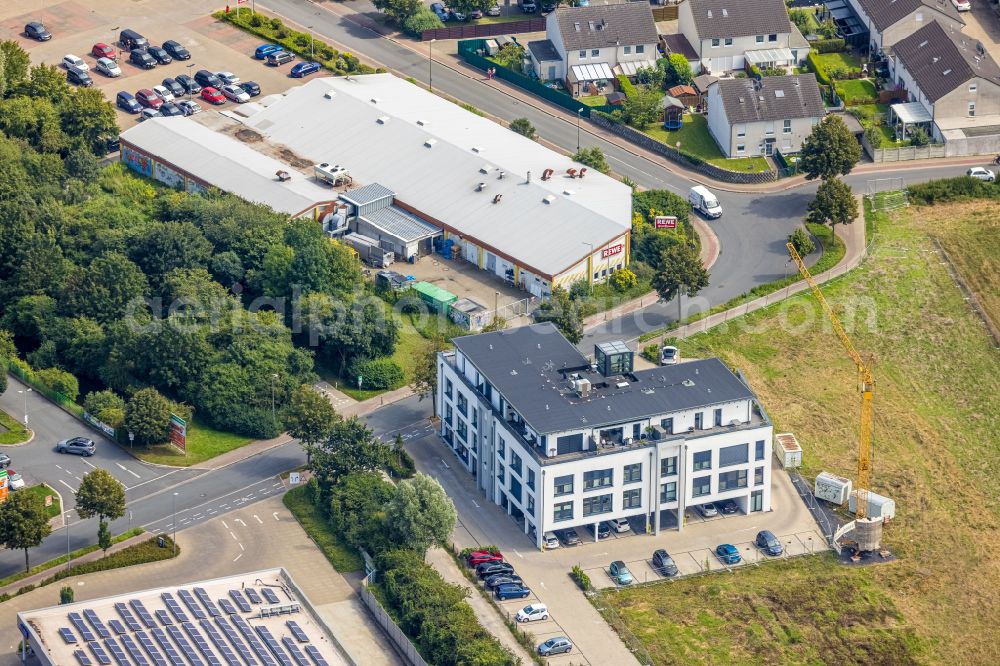 Bergkamen from above - Health and medical center and Rewe supermarket on street Geschwister-Scholl-Strasse in Bergkamen in the state North Rhine-Westphalia, Germany