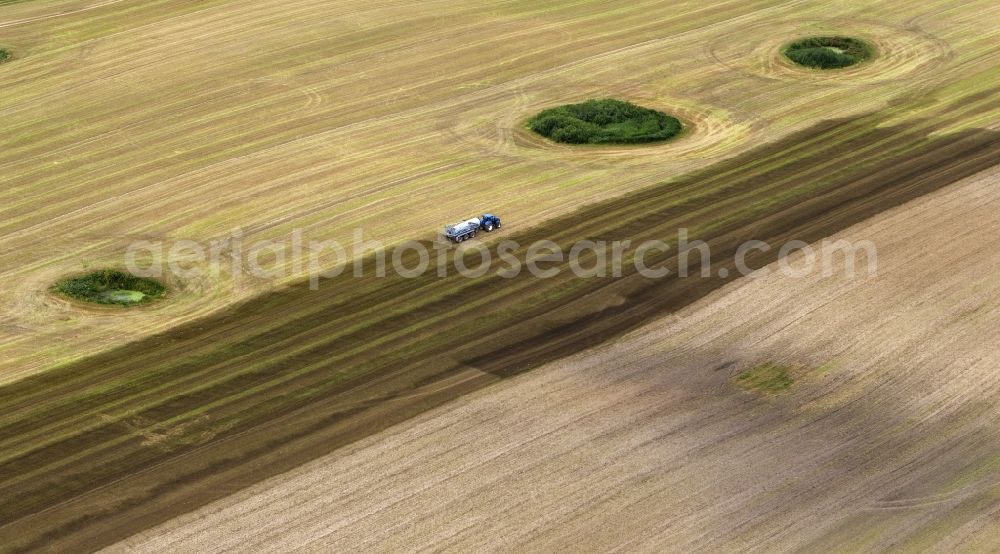 Kramerhof from the bird's eye view: Grain harvest in a field near Kramerhof in Mecklenburg - Western Pomerania