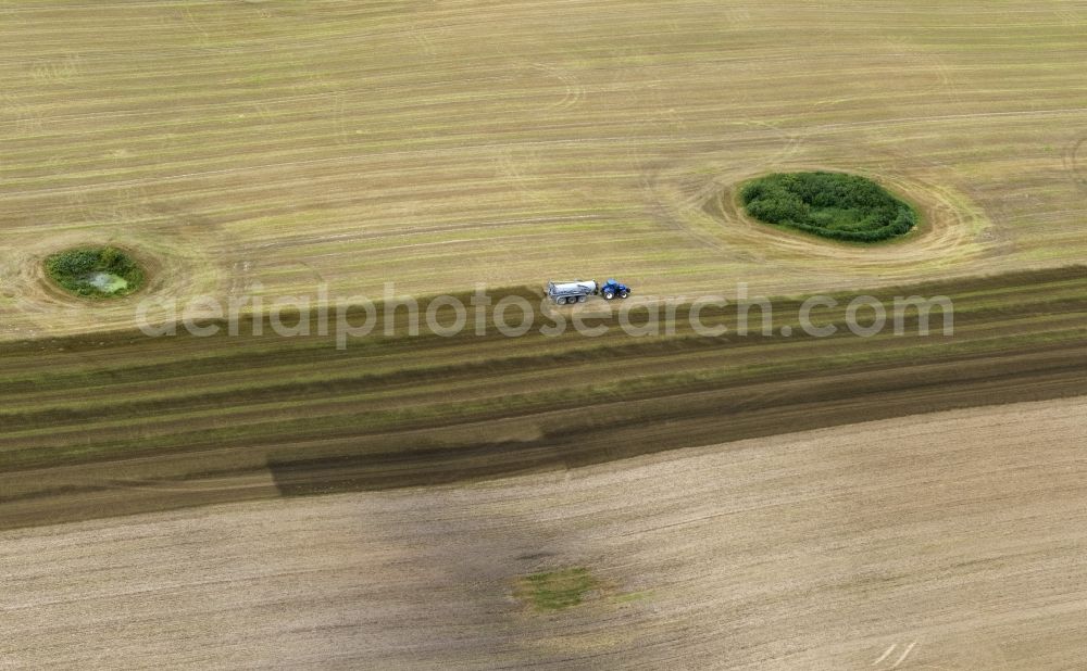 Aerial image Kramerhof - Grain harvest in a field near Kramerhof in Mecklenburg - Western Pomerania