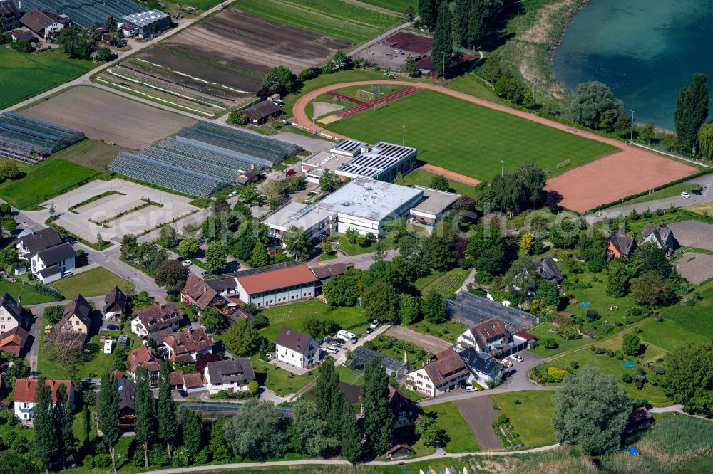 Aerial image Reichenau - Glass roof surfaces in the greenhouse for vegetable growing ranks auf of Bodensee Insel in Reichenau in the state Baden-Wuerttemberg, Germany