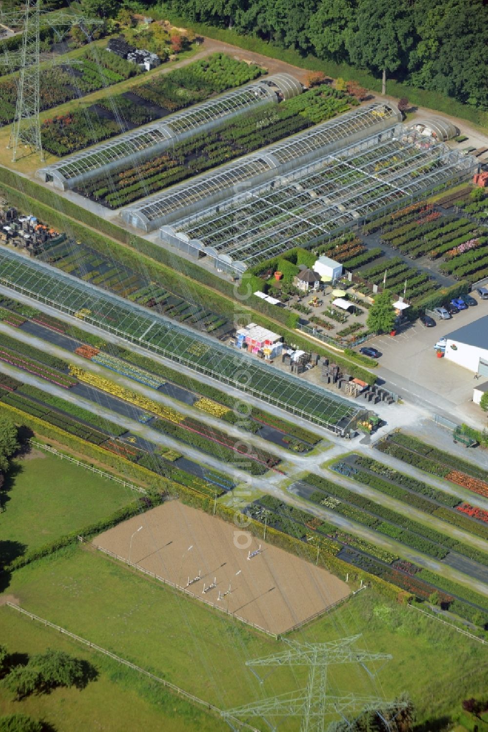 Aerial photograph Gütersloh - Glass roof surfaces in the greenhouse rows for Floriculture in Guetersloh in the state North Rhine-Westphalia