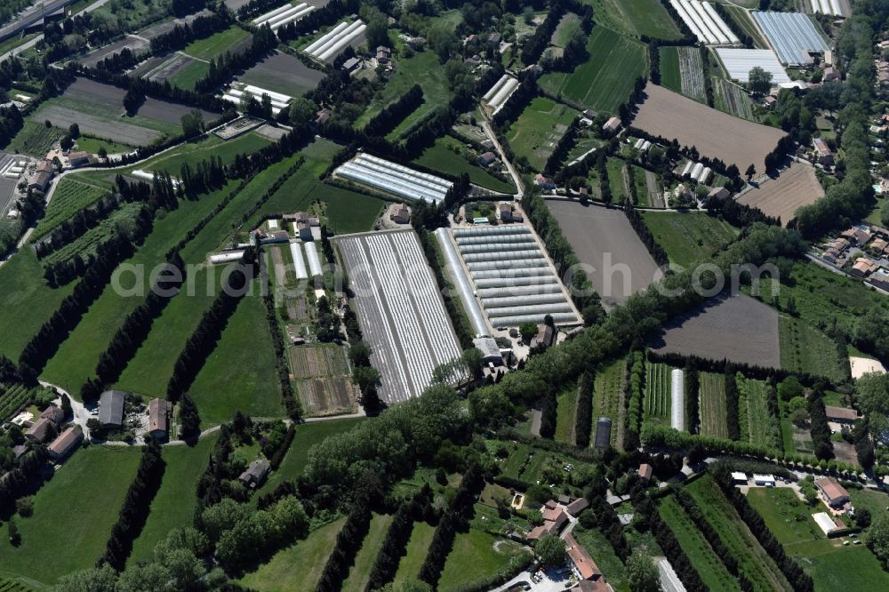 Aerial image Avignon - Glass roof surfaces in the greenhouse for vegetable growing ranks in Avignon in Provence-Alpes-Cote d'Azur, France