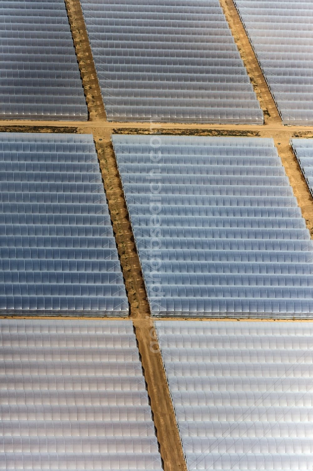 Torre del Greco from above - Glass roof surfaces in the greenhouse for vegetable growing ranks in Torre del Greco in Italy