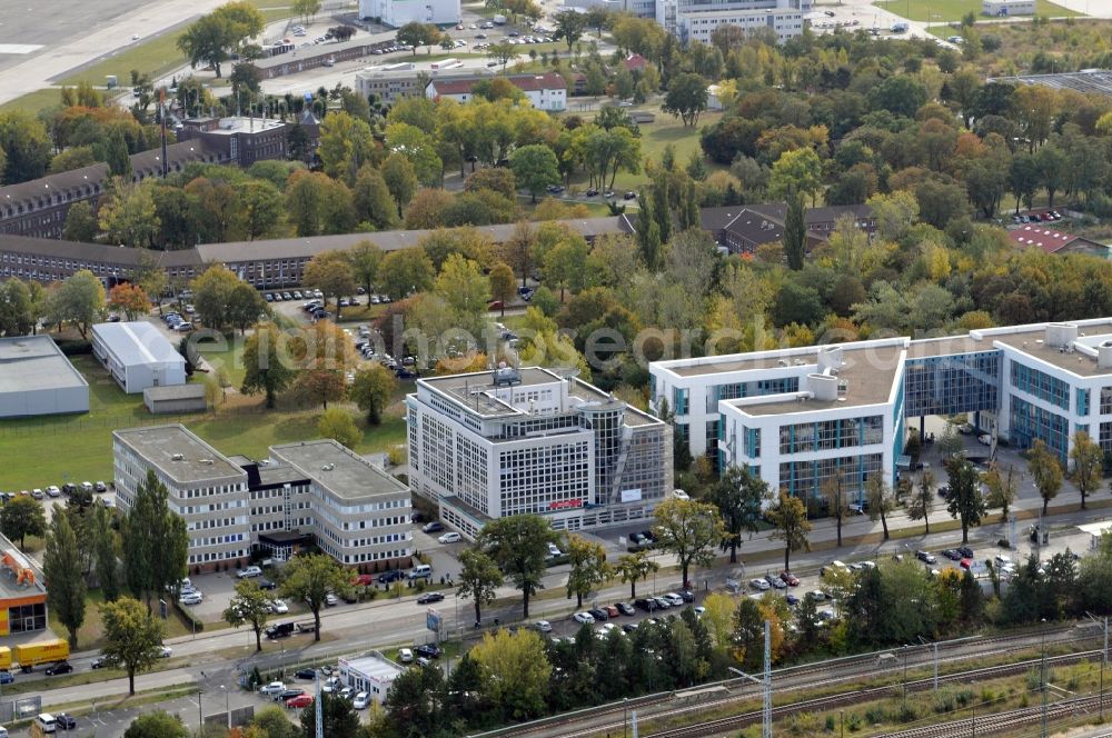 Schönefeld from above - The commercial and office buildings in the center road at Schoenefeld Airport in Brandenburg. Among others here, the Joint Upper Aviation Authority Berlin-Brandenburg, the company BSF SWISS PHOTO, Randstad Germany GmbH & Co. KG, VPS Transport Pilot School Berlin GmbH and Cockpit4u Aviation Service GmbH headquarters