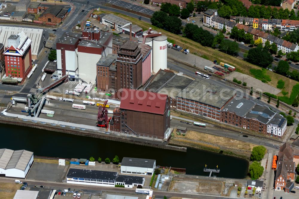 Bremen from the bird's eye view: Buildings and production halls on the food manufacturer's premises of ROLAND MILLS UNITED GmbH & Co. KG in the district Ueberseestadt in Bremen, Germany