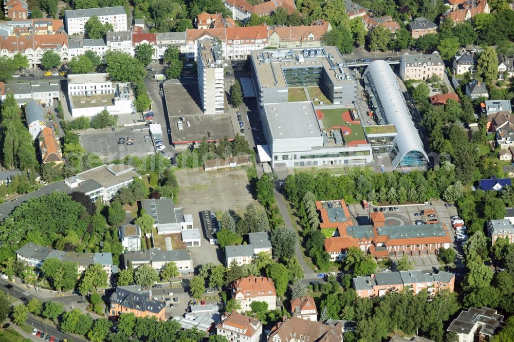 Aerial image Berlin - Gewerbebrache der ehemaligen KFZ - Pruefstelle Zehlendorf an der Charlottenstrasse in the residential area of a multi-family house settlement in Berlin in Germany. The company CDS housing Berlin GmbH is planning to build a modern residential complex