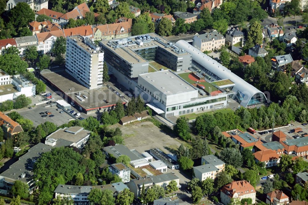 Aerial photograph Berlin - Gewerbebrache der ehemaligen KFZ - Pruefstelle Zehlendorf an der Charlottenstrasse in the residential area of a multi-family house settlement in Berlin in Germany. The company CDS housing Berlin GmbH is planning to build a modern residential complex