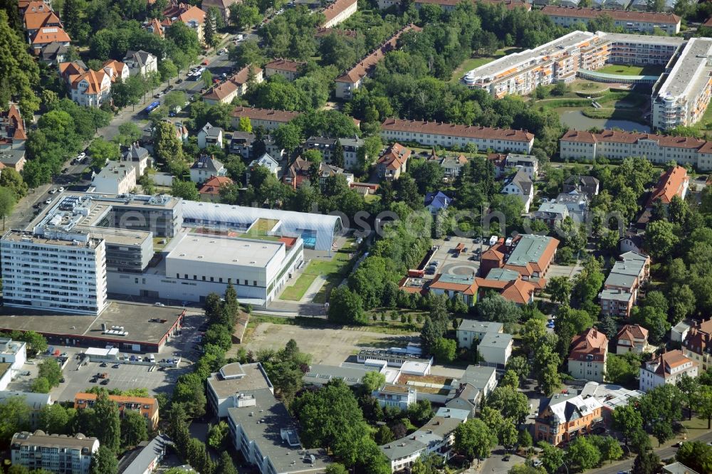 Berlin from the bird's eye view: Gewerbebrache der ehemaligen KFZ - Pruefstelle Zehlendorf an der Charlottenstrasse in the residential area of a multi-family house settlement in Berlin in Germany. The company CDS housing Berlin GmbH is planning to build a modern residential complex