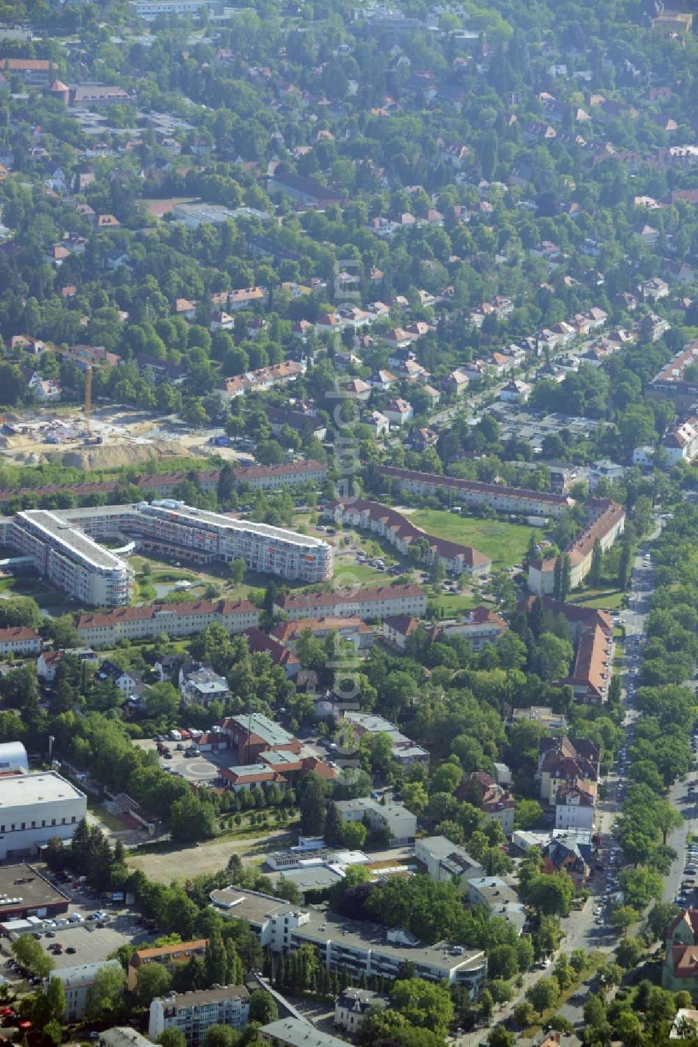 Aerial photograph Berlin - Gewerbebrache der ehemaligen KFZ - Pruefstelle Zehlendorf an der Charlottenstrasse in the residential area of a multi-family house settlement in Berlin in Germany. The company CDS housing Berlin GmbH is planning to build a modern residential complex