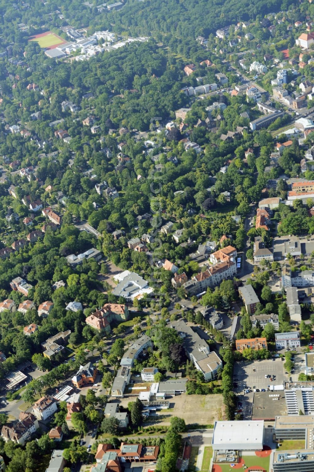 Berlin from the bird's eye view: Gewerbebrache der ehemaligen KFZ - Pruefstelle Zehlendorf an der Charlottenstrasse in the residential area of a multi-family house settlement in Berlin in Germany. The company CDS housing Berlin GmbH is planning to build a modern residential complex