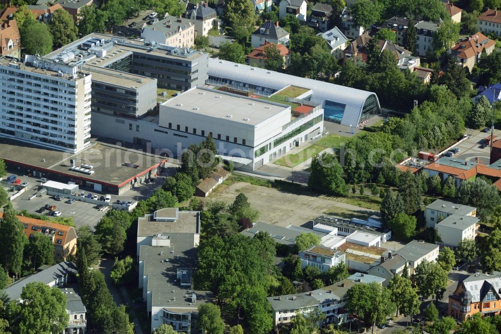 Aerial photograph Berlin - Gewerbebrache der ehemaligen KFZ - Pruefstelle Zehlendorf an der Charlottenstrasse in the residential area of a multi-family house settlement in Berlin in Germany. The company CDS housing Berlin GmbH is planning to build a modern residential complex