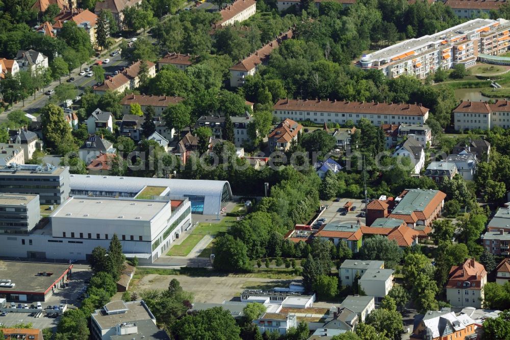 Berlin from the bird's eye view: Gewerbebrache der ehemaligen KFZ - Pruefstelle Zehlendorf an der Charlottenstrasse in the residential area of a multi-family house settlement in Berlin in Germany. The company CDS housing Berlin GmbH is planning to build a modern residential complex