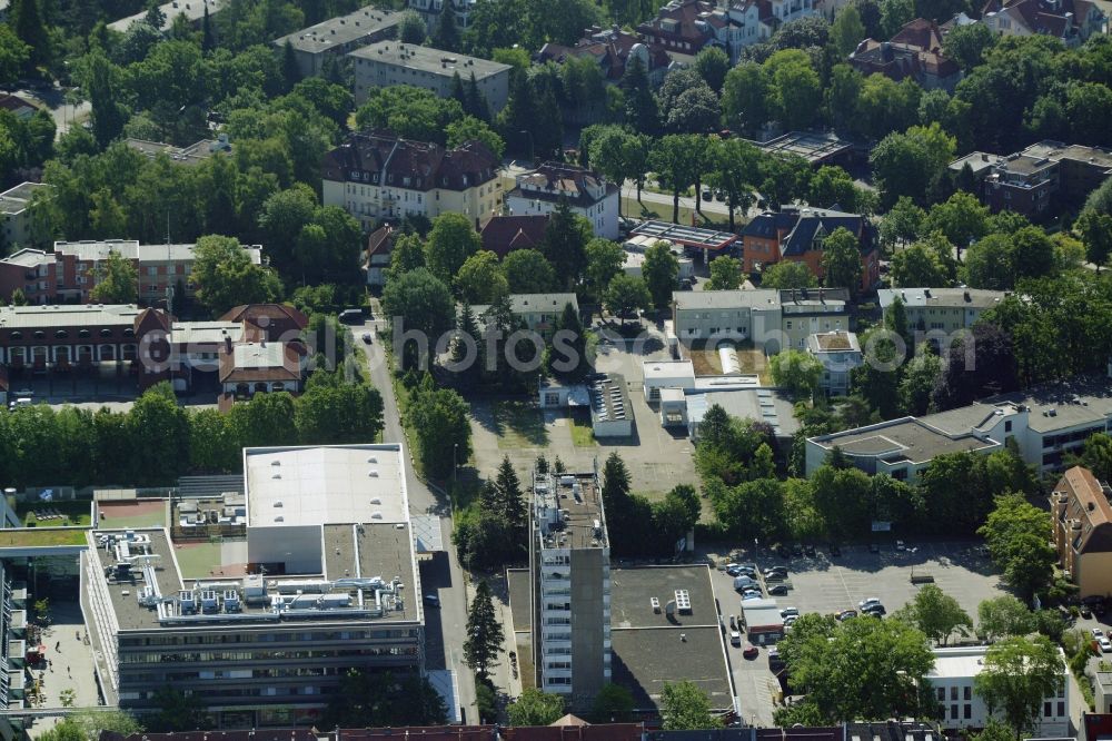 Aerial image Berlin - Gewerbebrache der ehemaligen KFZ - Pruefstelle Zehlendorf an der Charlottenstrasse in the residential area of a multi-family house settlement in Berlin in Germany. The company CDS housing Berlin GmbH is planning to build a modern residential complex