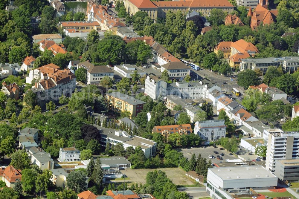 Berlin from the bird's eye view: Gewerbebrache der ehemaligen KFZ - Pruefstelle Zehlendorf an der Charlottenstrasse in the residential area of a multi-family house settlement in Berlin in Germany. The company CDS housing Berlin GmbH is planning to build a modern residential complex