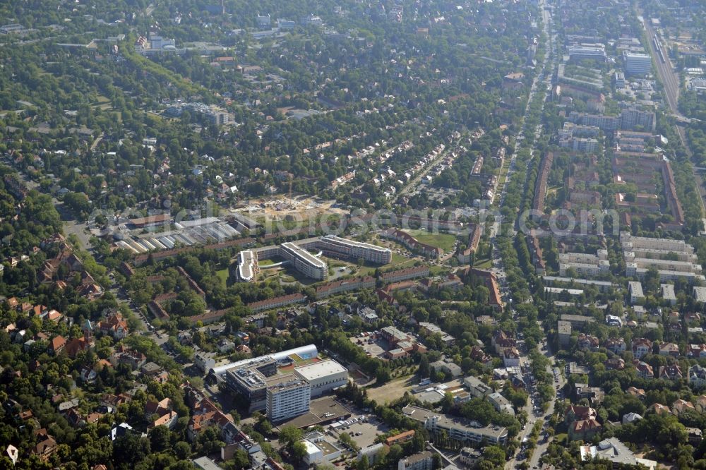 Aerial photograph Berlin - Gewerbebrache der ehemaligen KFZ - Pruefstelle Zehlendorf an der Charlottenstrasse in the residential area of a multi-family house settlement in Berlin in Germany. The company CDS housing Berlin GmbH is planning to build a modern residential complex