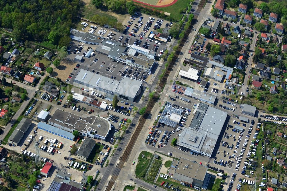 Aerial photograph Berlin - View at the industrial area Hansastraße in the district Weissensee in Berlin. Here are among others several car dealers, workshops and an inspection workshop of the DEKRA located