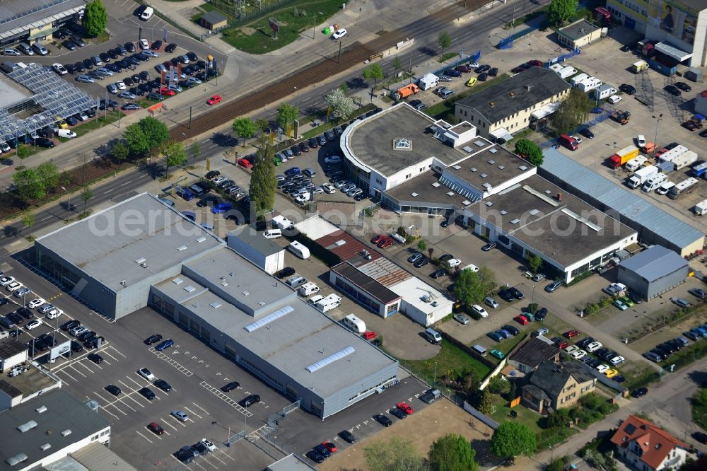 Aerial image Berlin - View at the industrial area Hansastraße in the district Weissensee in Berlin. Here are among others several car dealers, workshops and an inspection workshop of the DEKRA located