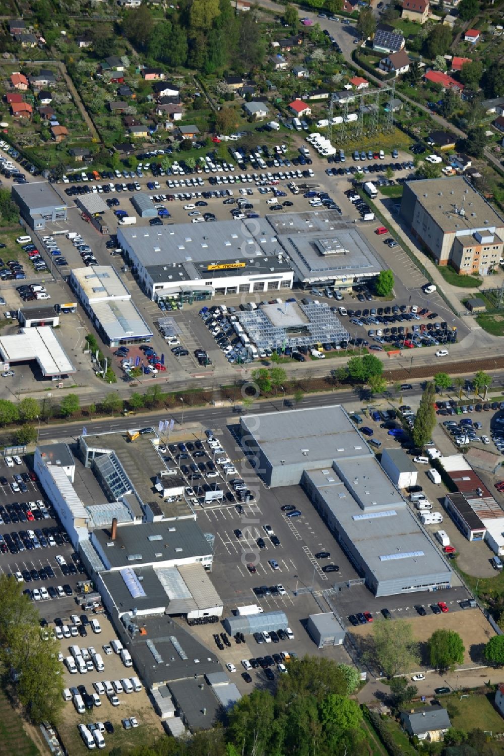 Aerial photograph Berlin - View at the industrial area Hansastraße in the district Weissensee in Berlin. Here are among others several car dealers, workshops and an inspection workshop of the DEKRA located