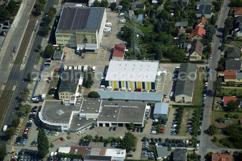 Weißensee, Berlin from the bird's eye view: View at the industrial area Hansastrasse in the district Weissensee in Berlin. Here are among others several car dealers, workshops and an inspection workshop of the DEKRA located