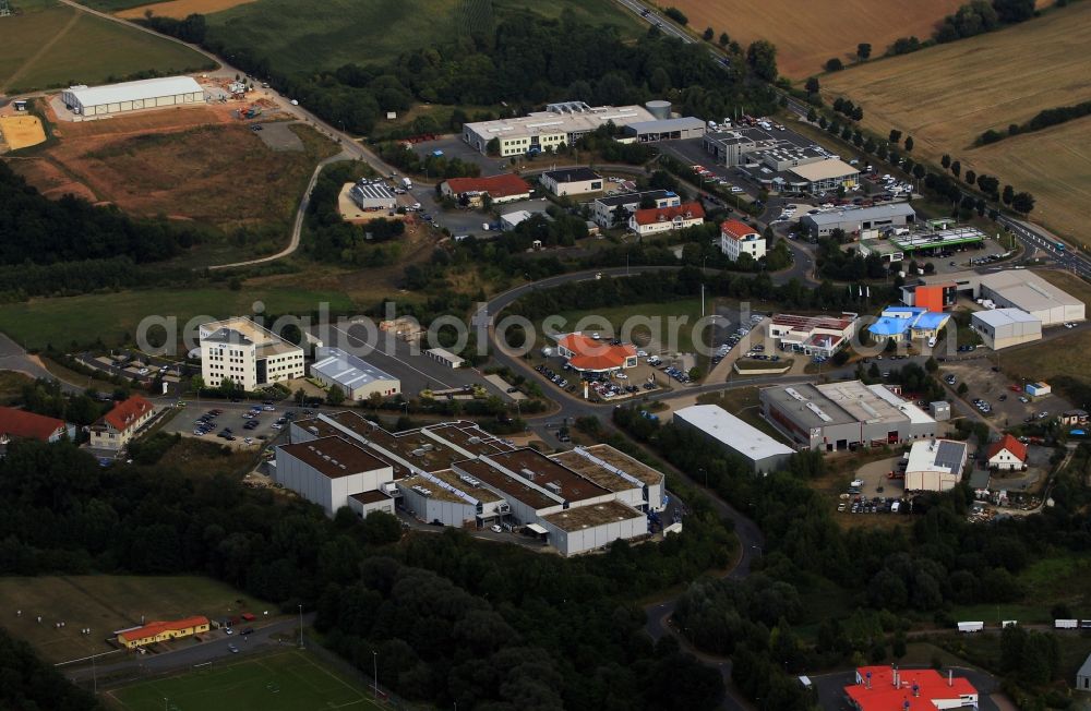 Heilbad Heiligenstadt from the bird's eye view: Commercial area with car dealerships houses on the streets Nordhäuser Strasse and the Carl-Zeiss-Strasse in Heilbad Heiligenstadt in Thuringia