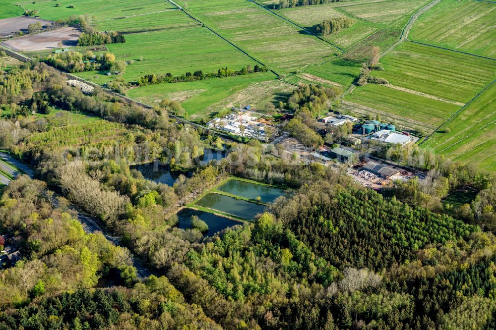 Nottensdorf from the bird's eye view: Commercial area and company settlement on the railway in Nottensdorf in the state Lower Saxony, Germany