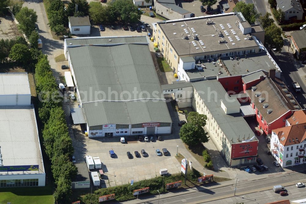 Berlin from above - Industrial estate and company settlement in Berlin in Germany. Based in this building are the Neuwagenzentrum Berlin Ost AG and the Muellers Angelmarkt