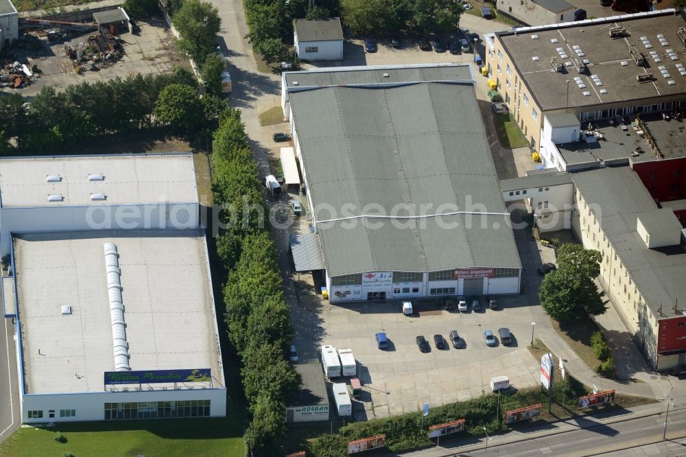 Berlin from the bird's eye view: Industrial estate and company settlement in Berlin in Germany. Based in this building are the Neuwagenzentrum Berlin Ost AG and the Muellers Angelmarkt