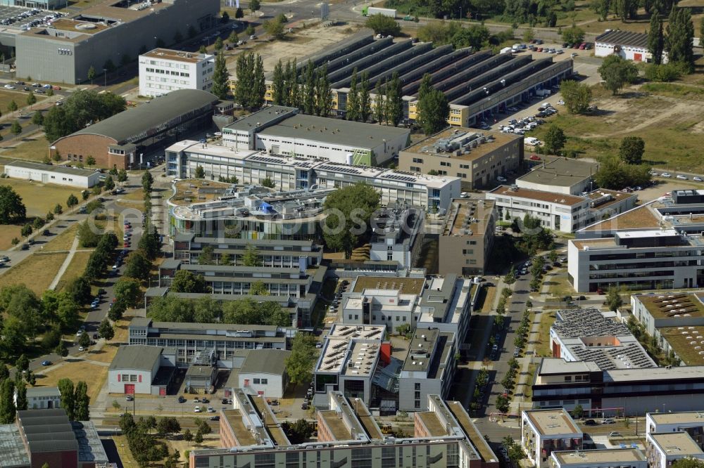 Berlin from the bird's eye view: Industrial estate and company settlement at the crossroads Friedrich-Woehler-Strasse and Schwarzschildstrasse in Berlin in Germany