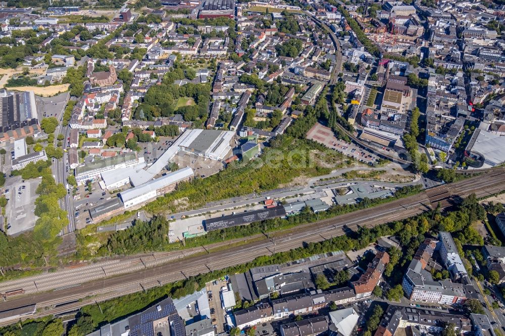 Bochum from the bird's eye view: Industrial estate and company settlement overlooking the culture center Rotunde Bochum along the rail course on Konrad-Adenauer-Platz in the district Innenstadt in Bochum in the state North Rhine-Westphalia, Germany