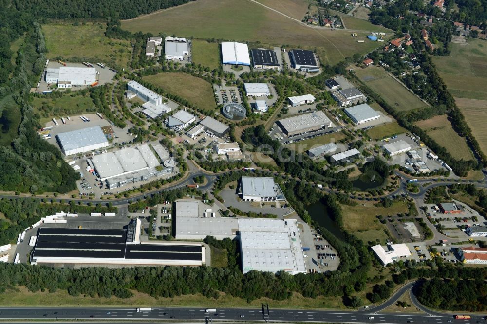 Ludwigsfelde from above - Industrial estate and company settlement in at the motorway exit Genshagen in the state of Brandenburg. The area is part of the large Brandenburg Park complex