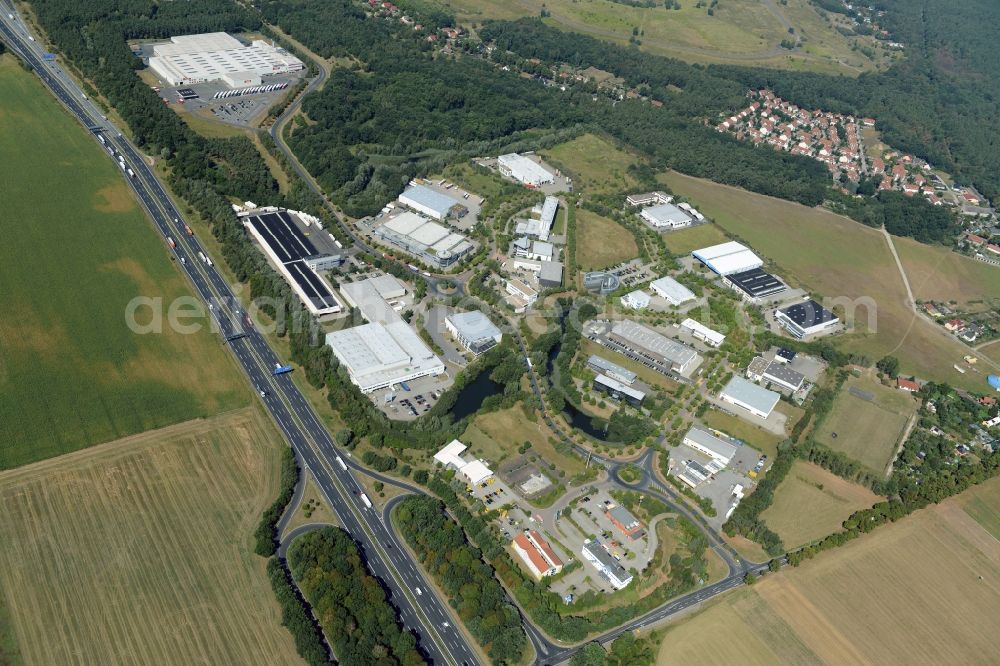 Aerial photograph Ludwigsfelde - Industrial estate and company settlement in at the motorway exit Genshagen in the state of Brandenburg. The area is part of the large Brandenburg Park complex