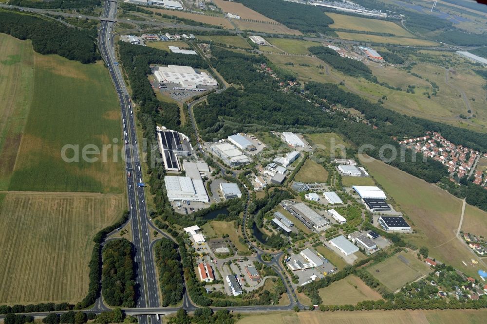 Ludwigsfelde from above - Industrial estate and company settlement in at the motorway exit Genshagen in the state of Brandenburg. The area is part of the large Brandenburg Park complex