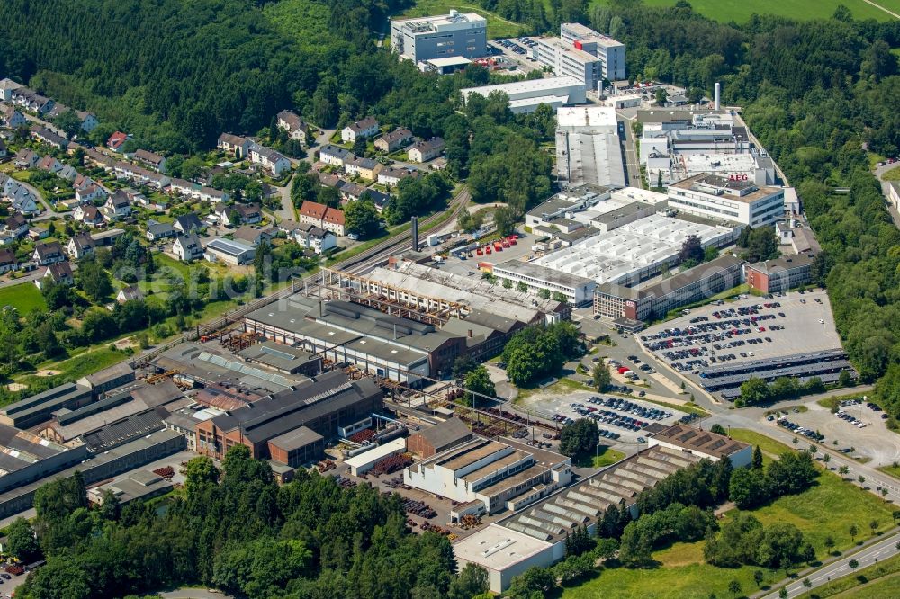 Warstein from the bird's eye view: Commercial area and business establishment at the Emil-Siepmann-street in Warstein in North Rhine-Westphalia. Here sits et al the semiconductor business of Infineon Technologies AG Warstein, the AEG Power Solutions GmbH and the Siepmann - works GmbH & Co KG