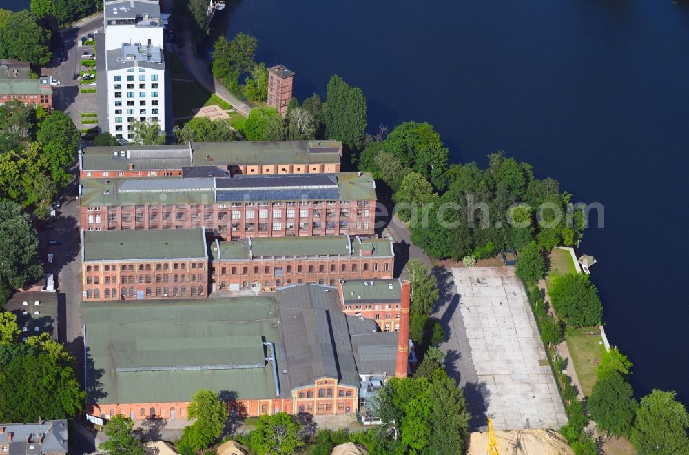 Berlin from the bird's eye view: Industrial estate and company settlement along the Eiswerderstrasse in the district Hakenfelde in Berlin, Germany