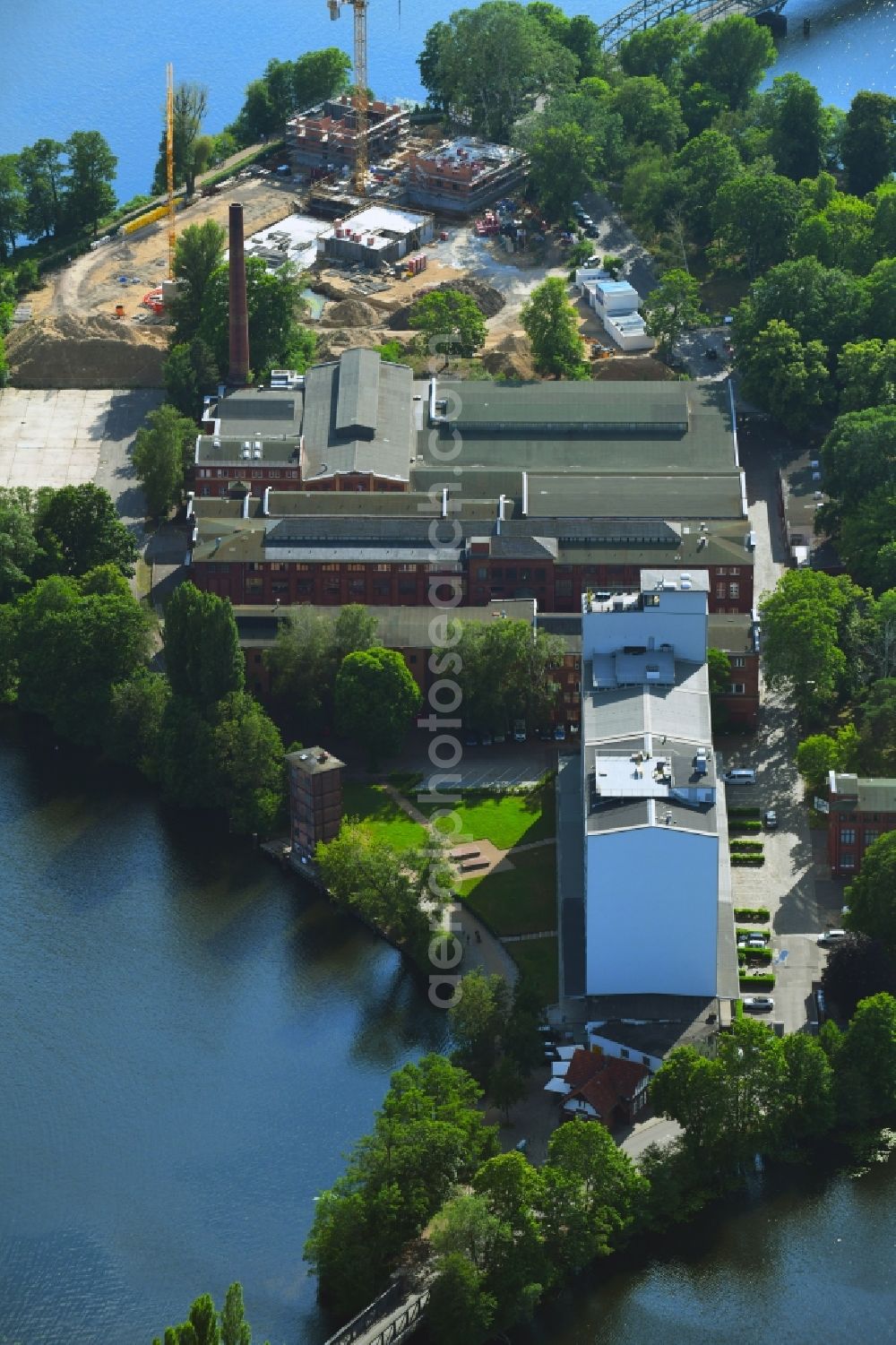 Berlin from the bird's eye view: Industrial estate and company settlement along the Eiswerderstrasse in the district Hakenfelde in Berlin, Germany