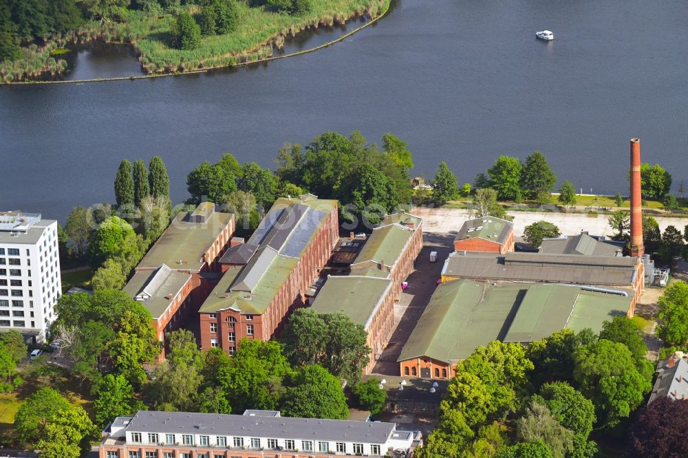 Berlin from the bird's eye view: Industrial estate and company settlement along the Eiswerderstrasse in the district Hakenfelde in Berlin, Germany