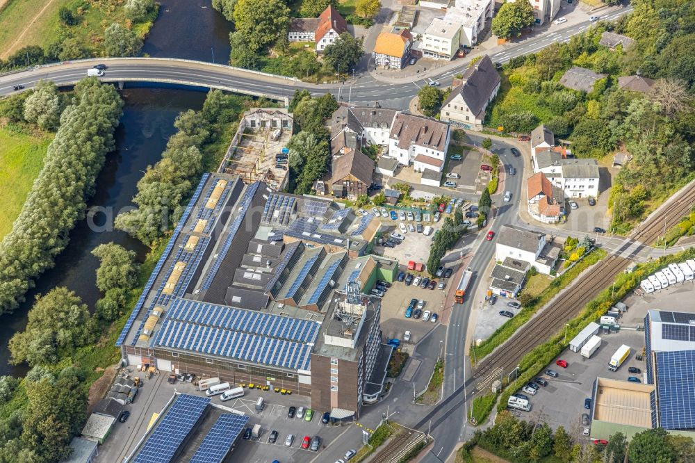 Aerial photograph Fröndenberg/Ruhr - Industrial estate and company settlement along the Ruhr with a bridge structure at Unnaer Strasse / Ardeyer Strasse in the district Langschede in Froendenberg/Ruhr in the state North Rhine-Westphalia, Germany