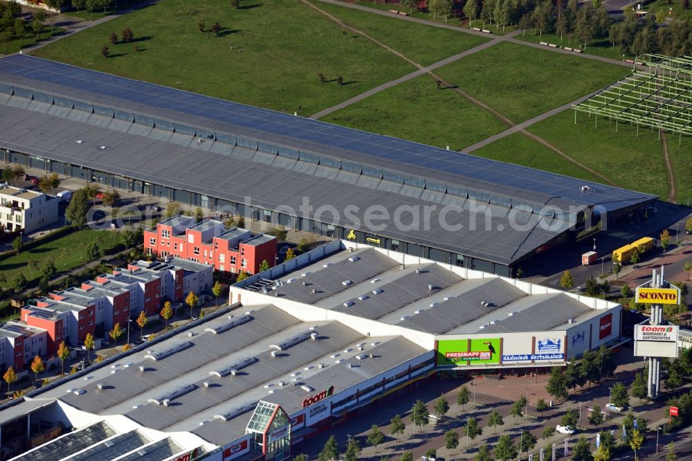 Aerial image Berlin - View of a commercial area in the development zone Alter Schlachthof on the border of the districts Lichtenberg, Friedrichshain and Prenzlauer Berg. On the grounds of the former central stockyard a modern city quarter with residential and commercial space is being developed to put the old industrial buildings to new use