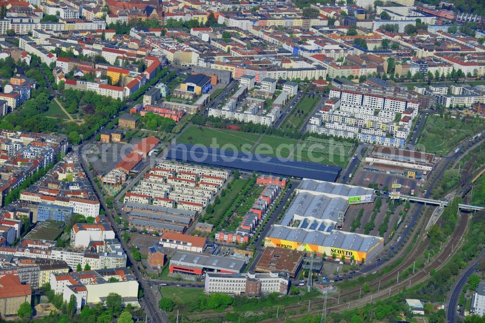 Aerial photograph Berlin - View of a commercial area in the development zone Alter Schlachthof on the border of the districts Lichtenberg, Friedrichshain and Prenzlauer Berg. On the grounds of the former central stockyard a modern city quarter with residential and commercial space is being developed to put the old industrial buildings to new use