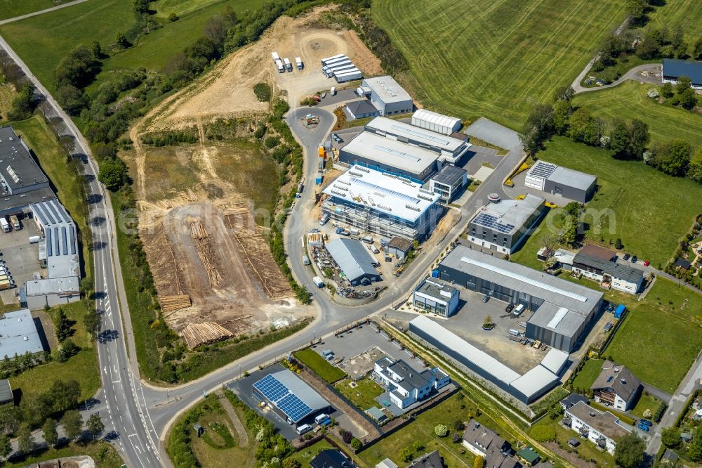 Aerial photograph Kirchhundem - Industrial estate and company settlement with an extension construction site on the premises of HYDROPHON Kunststofftechnik GmbH Zum Eulenbruch in Kirchhundem in the state North Rhine-Westphalia, Germany