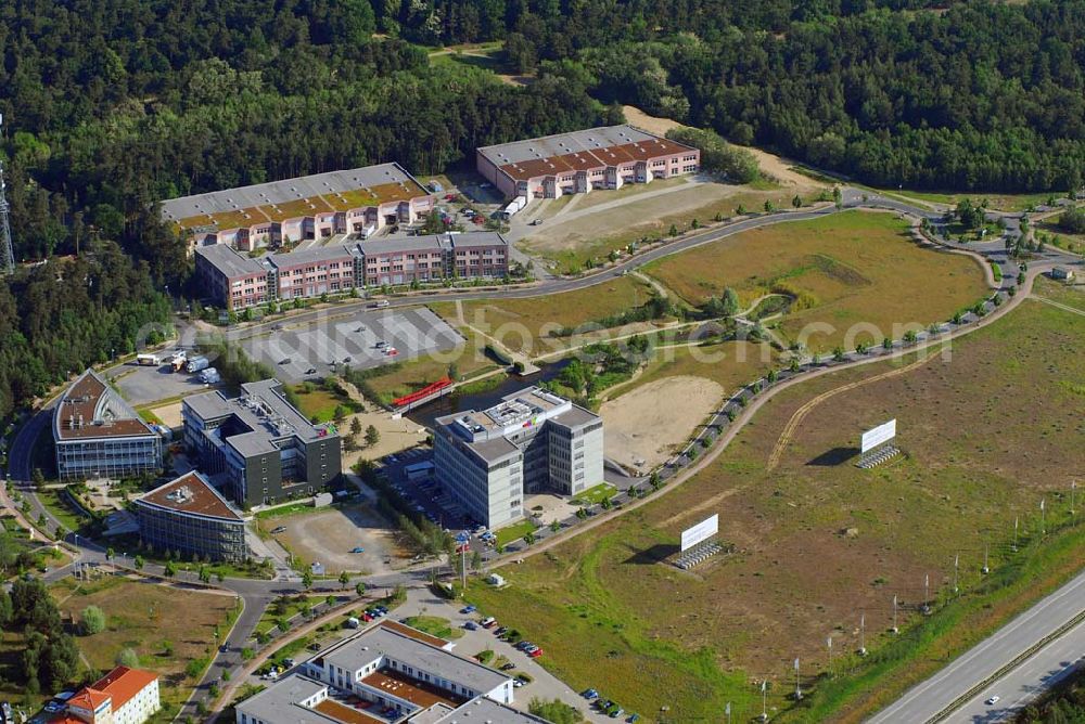 Aerial photograph Kleinmachnow - Blick auf das Gewerbegebiet Europark Dreilinden bei Kleinmachnow. Das Gewerbegebiet Europark wurde nach der Wende auf dem Gelände der ehemaligen Autobahn-Kontrollstelle Dreilinden errichtet. Heute sind dort Unternehmen wie das Achim Walder Auktionshaus ebay tätig.