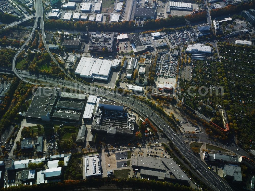 Berlin from above - Industrial estate and company settlement between Teltow channel and federal motorway A100 in the Tempelhof part of Berlin in Germany. The area is located at the motorway exit Gradestrasse. It consists of several company compounds and halls such as Loxxess