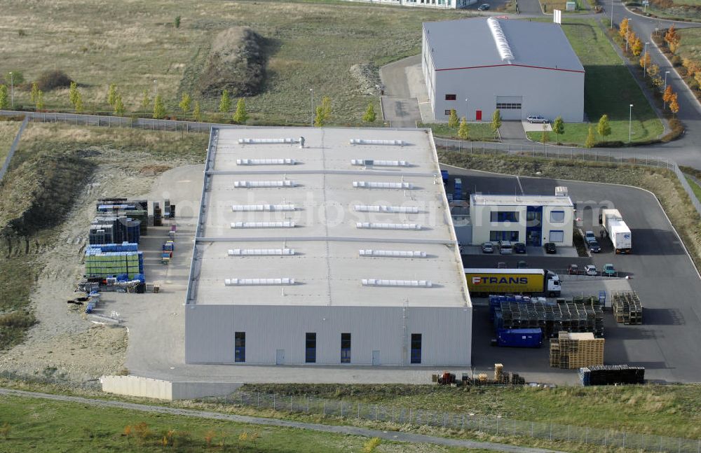 Aerial image Eisenach - Blick auf das Gewerbegebiet am Flugplatz Eisenach - Kindel in Thüringen. Dieses Gewerbegebiet liegt in unmittelbarer Umgebung vom Flugplatz Eisenach - Kindel. Es siedeln sich stetig neue Industriebetriebe auf dem Gelände an, so dass der Ausbau des Flugplatzes Eisenach - Kindel wohl nie stattfinden wird.