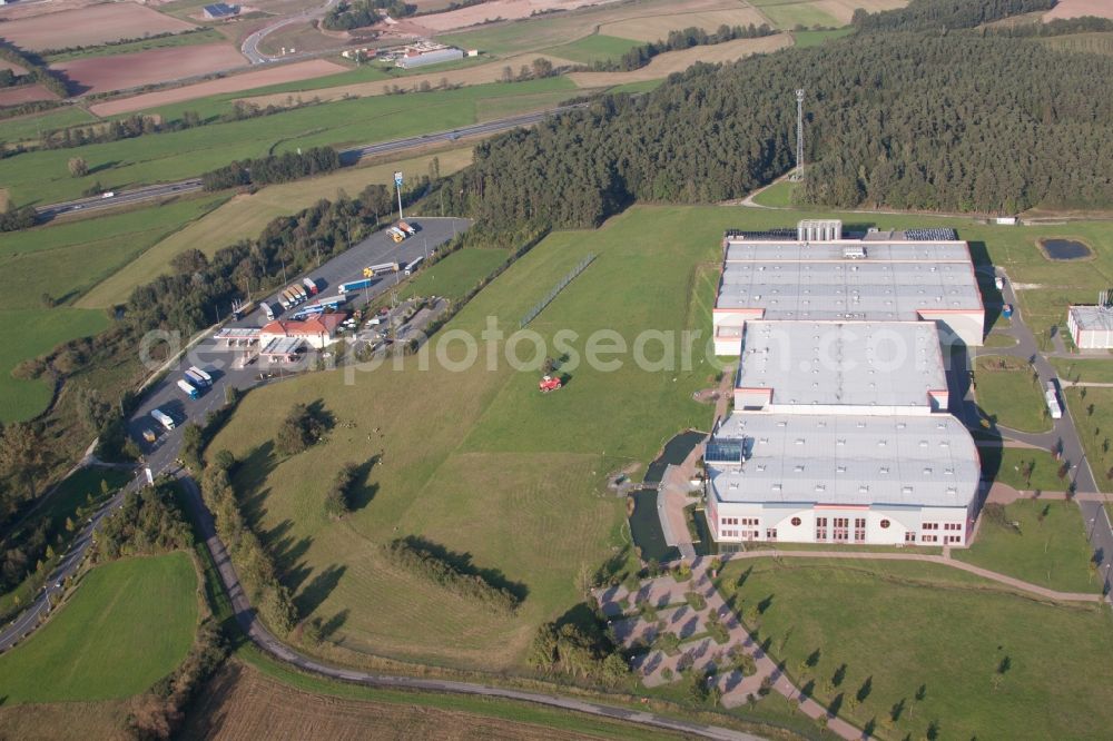 Burghaslach from above - Industrial estate and company settlement Gewerbeflaechen Autobahn A3 bei Kempea??s Autohof Burghaslach in the district Gleissenberg in Burghaslach in the state Bavaria, Germany