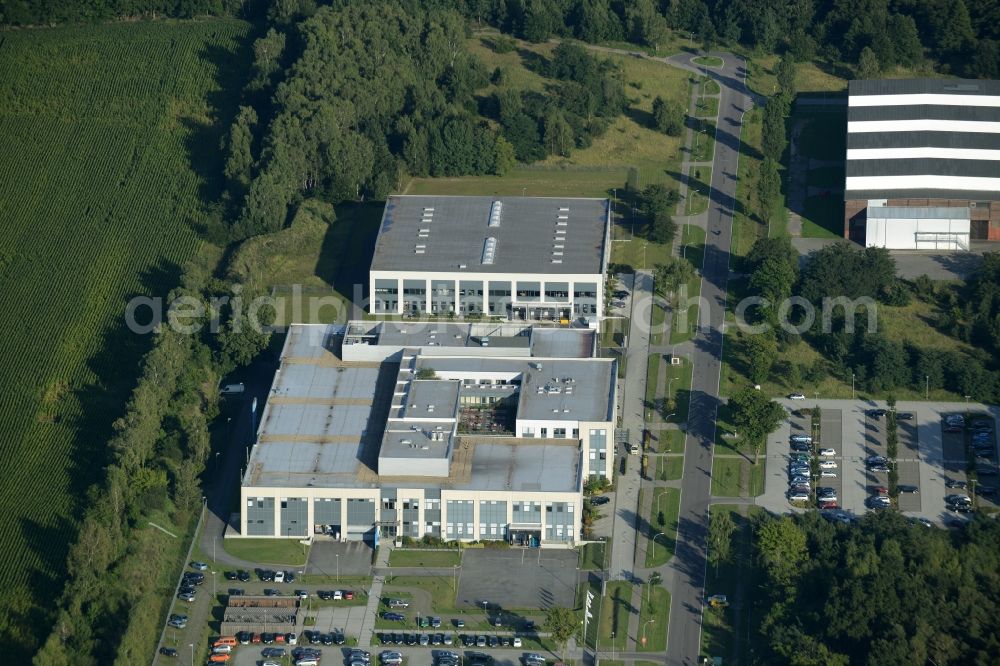 Aerial image Rathenow - Industrial estate and company settlement Heidefeld in the South of Rathenow in the state of Brandenburg. The compound includes a car dealership and production facilities of the glasses producer Fielmann