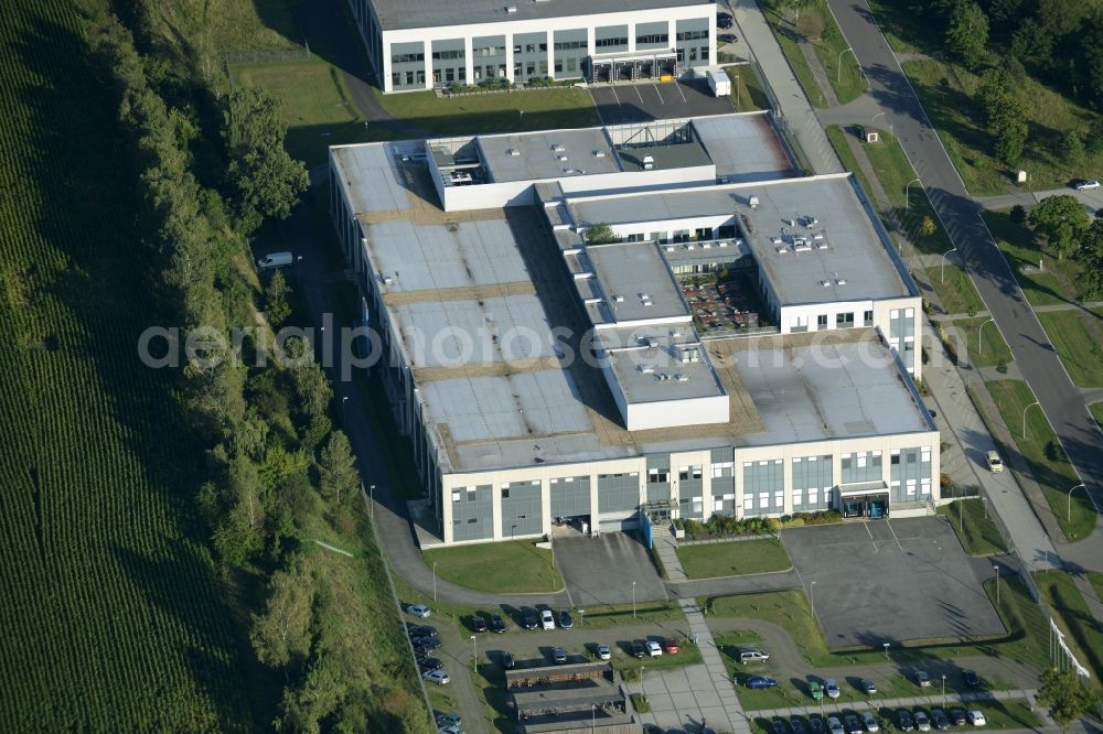 Rathenow from the bird's eye view: Industrial estate and company settlement Heidefeld in the South of Rathenow in the state of Brandenburg. The compound includes a car dealership and production facilities of the glasses producer Fielmann