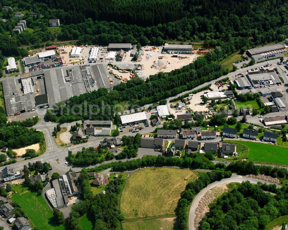 Bad Berleburg from the bird's eye view: Industrial estate and company settlement Am Hilgenacker in Bad Berleburg at Siegerland in the state North Rhine-Westphalia, Germany