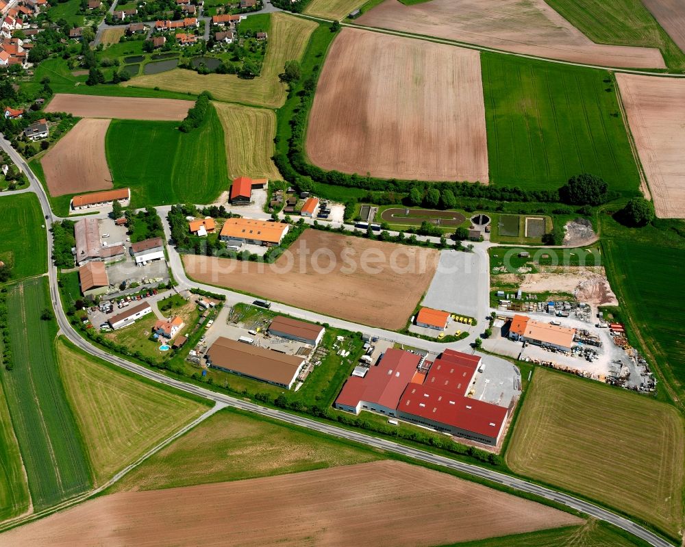 Flachslanden from the bird's eye view: Industrial estate and company settlement on Industriestrasse in Flachslanden in the state Bavaria, Germany