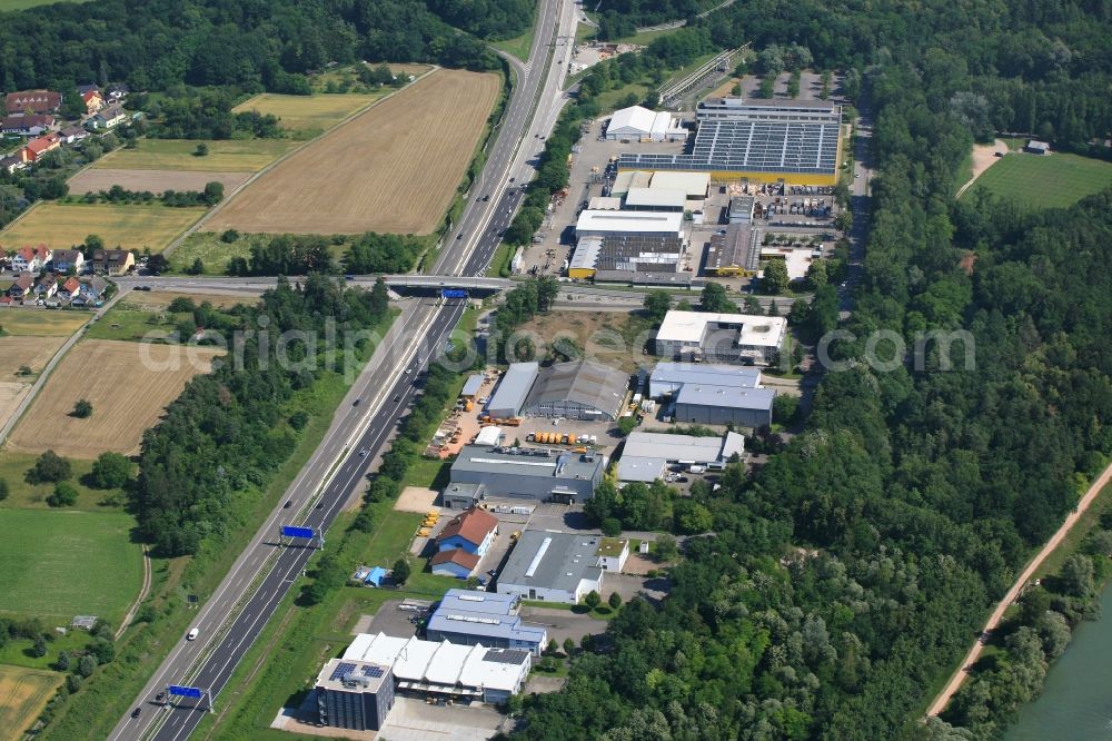 Weil am Rhein from the bird's eye view: Industrial estate and company settlements in the district Maerkt beside the motorway BAB A5 in Weil am Rhein in the state Baden-Wurttemberg, Germany